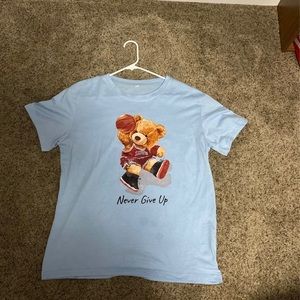 Blue men’s graphic tee worn once and in great condition.